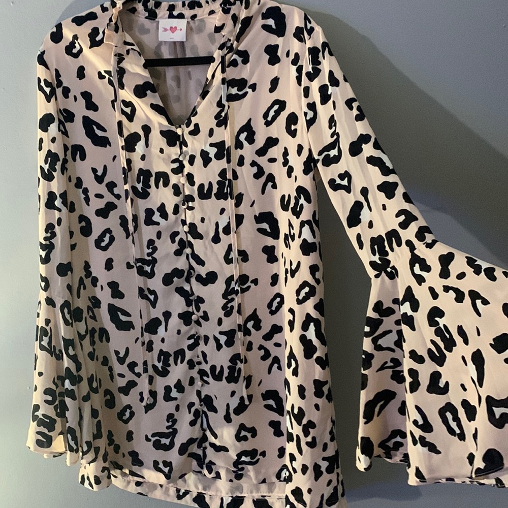 Light pink and black cow print tunic. No blemishes. Like new